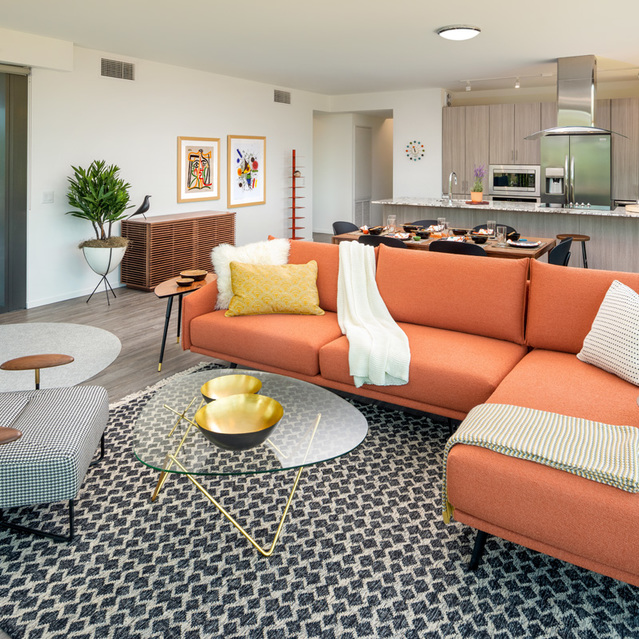 Optima Sonoran Village - Living Room with Cozy Couch and Kitchen View