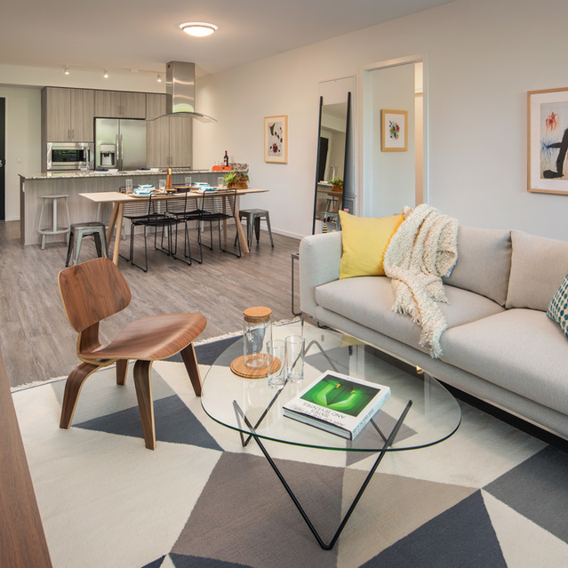 Optima Sonoran Village - Living Room with Cozy Couch and Kitchen View