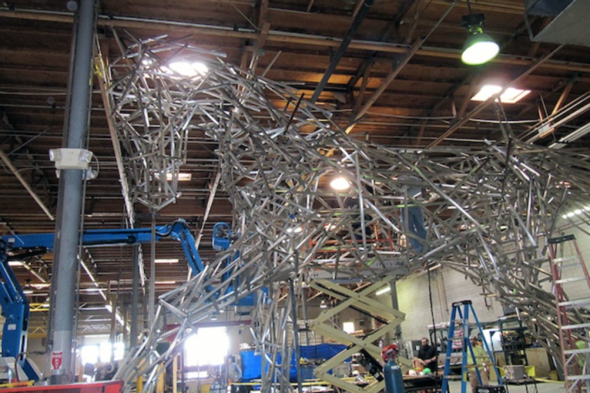 Large metal sculpture of a horse, Impulsion, being constructed in an industrial workshop for Scottsdale Public Art.