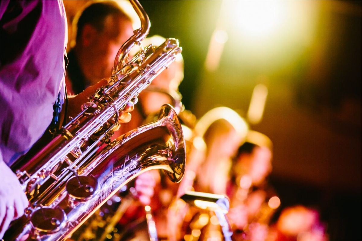 Close-up of saxophone players performing on stage under bright, warm lights at the 2025 Scottsdale Jazz Festival this spring.