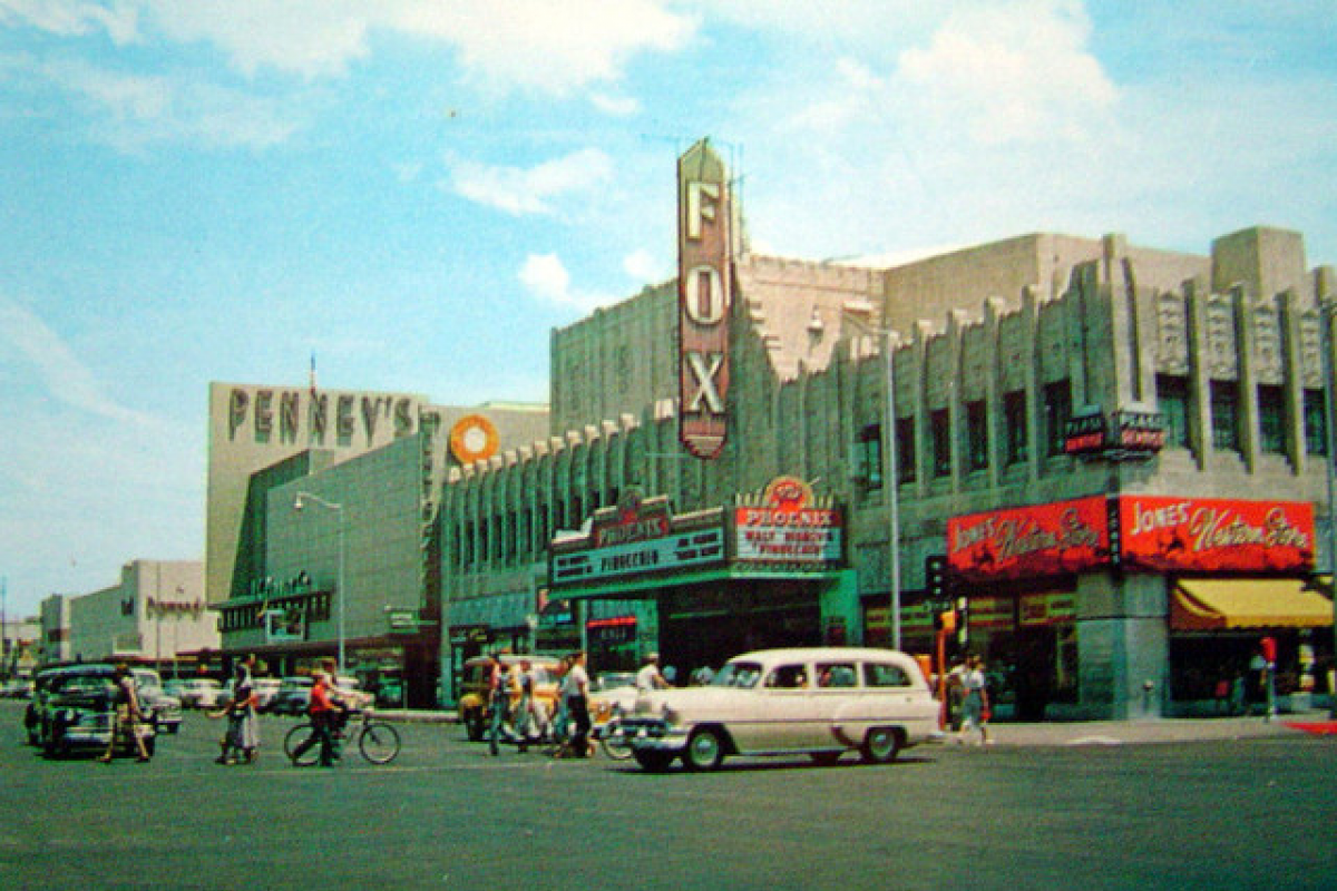 1950s Phoenix city street: people, vintage cars, Penney’s, and the iconic Fox West Coast Theater under a blue sky—Then and Now.