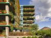 Modern Optima Sonoran Village apartment building featuring tiered balconies with orange railings, vertical slats, and abundant greenery.