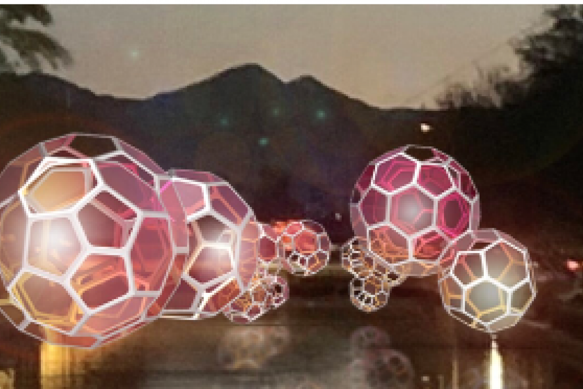 Glowing geometric spheres float over a waterfront canal at dusk during Canal Convergence 2024, with mountains in the background.